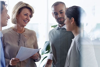 Caucasian female professional talking to young couple